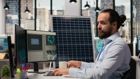 specialist develops clean energy solutions, drinks coffee, talks with coworker
