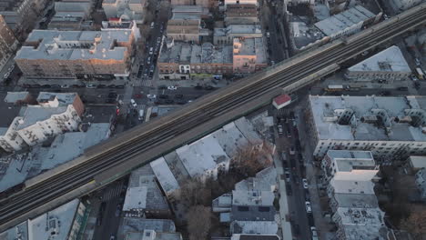 aerial view of the subway passing through brooklyn. shot at dusk.