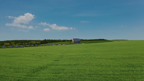 solar farm on green field. flying over the field of agricultural plants to the modern complex with many solar panels. alternative energy. aerial view.