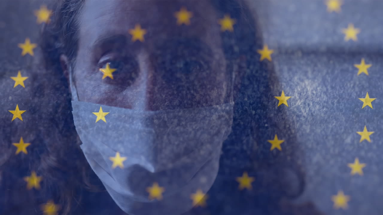 video compuesto digital de la bandera de la ue moviéndose contra una mujer con una máscara facial en el fondo