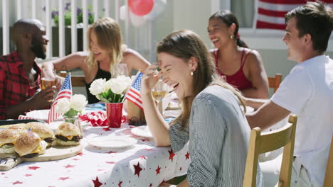 friends having fun at a 4th of july patio party