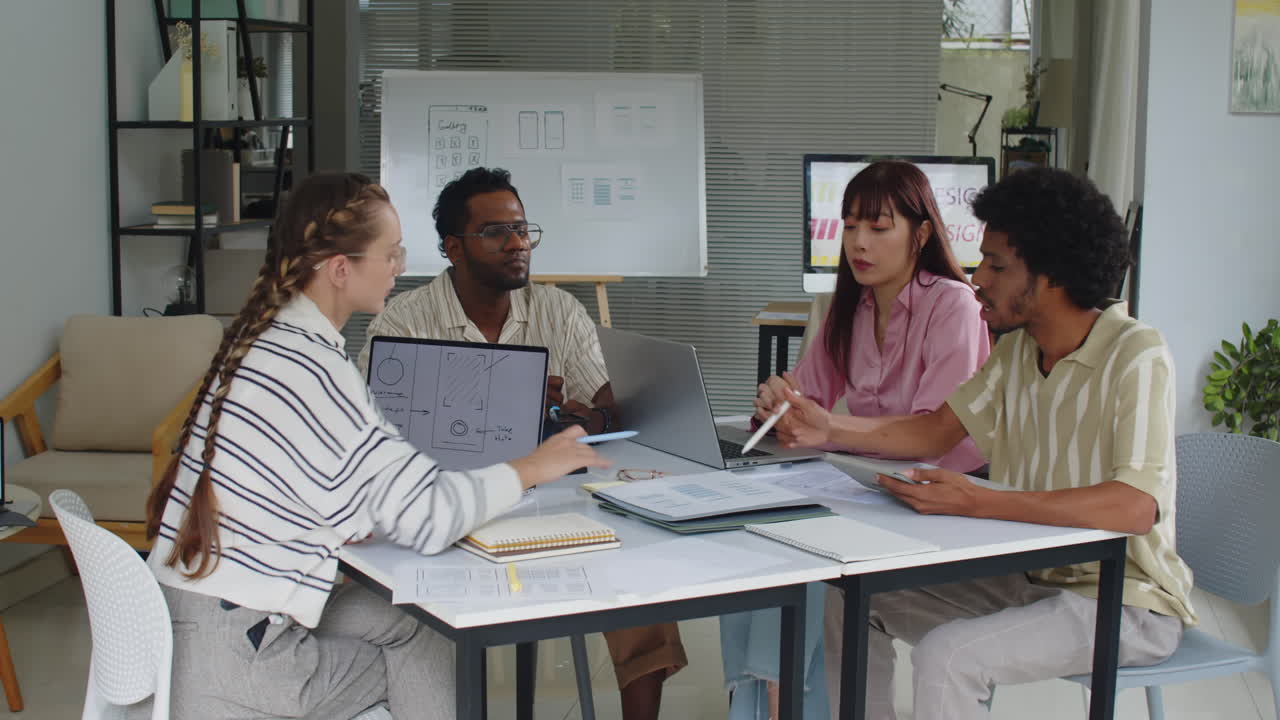 Multicultural Graphic Designers Having Meeting at Office