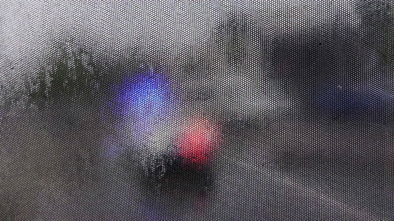 Blurry view of a police car moving in the traffic