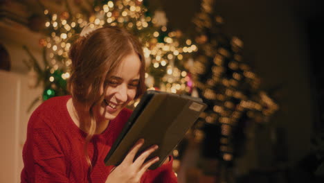 young woman using digital tablet at home