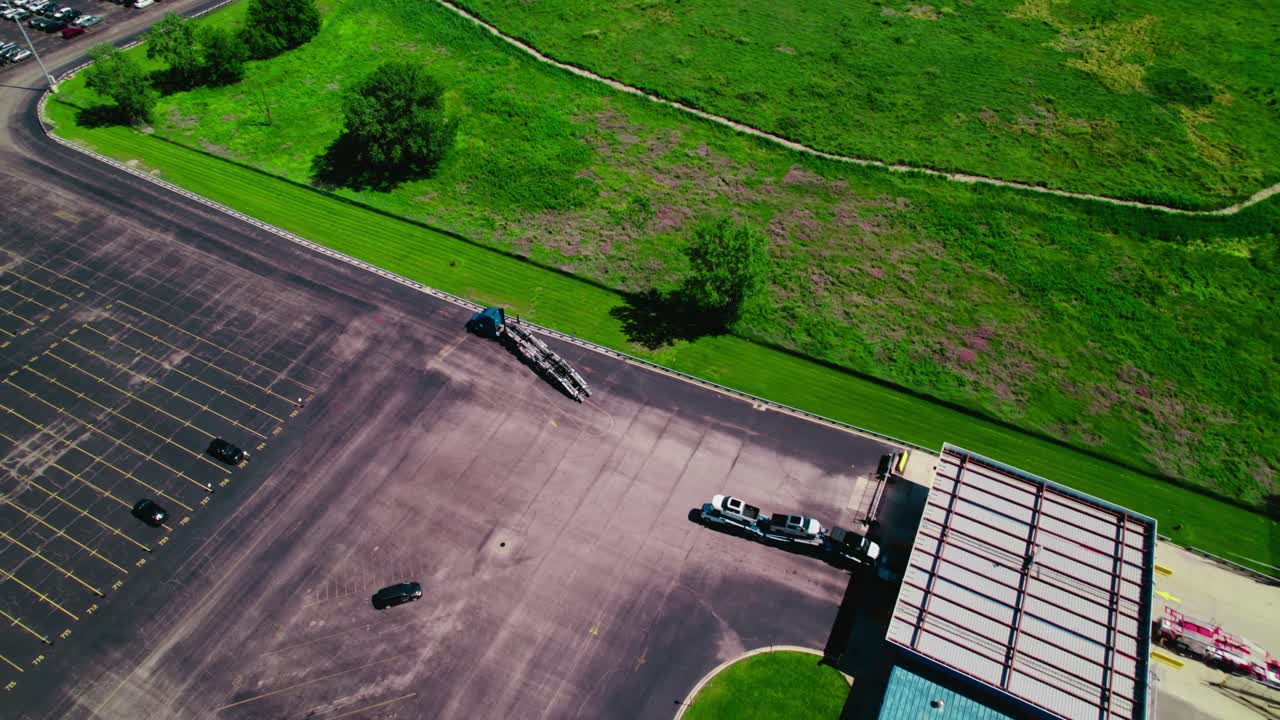 A car hauler truck enters the port terminal near chicago to load new imported cars.