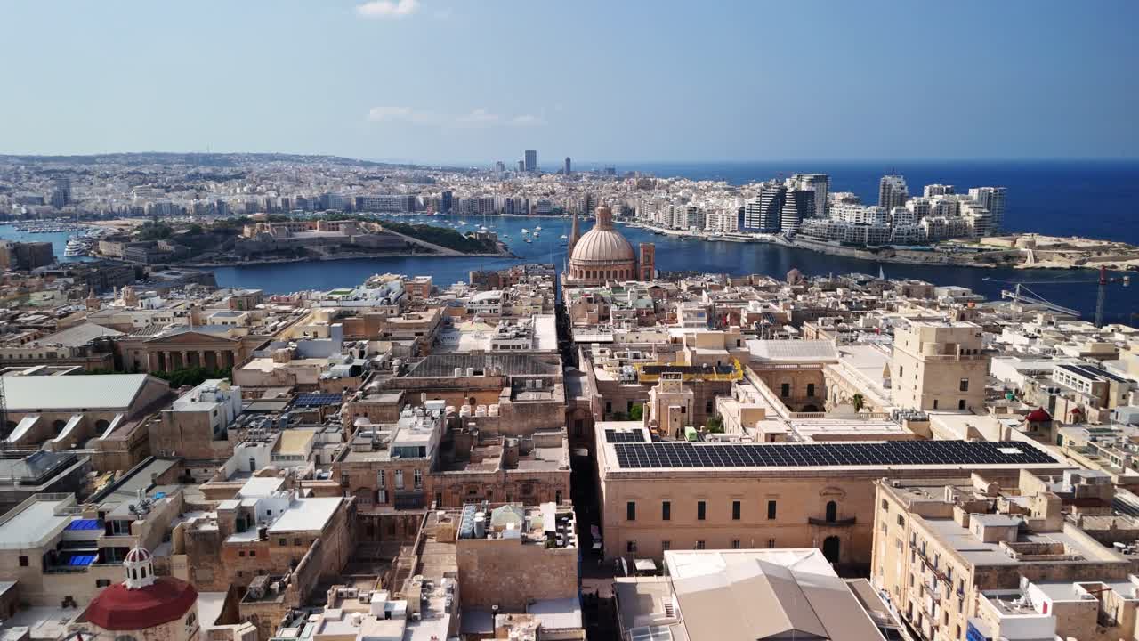 Aerial view of a historic city by the sea, sunny day, cultural heritage