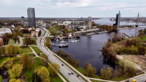 City-Road-With-Zunda-Towers-In-Riga,-Latvia---Aerial-Drone-Shot