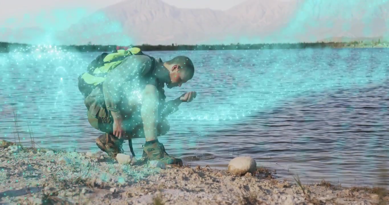 Hiker crouching touching stone initiating glowing energy ribbon wrapping torso for technology demo