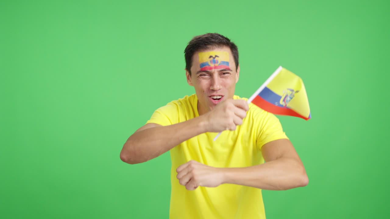 Man cheering for Ecuador screaming and waving a national flag