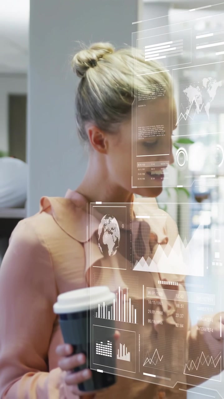 Vertical video: Business woman turning to appearing UI holding coffee, tapping graphs checking data