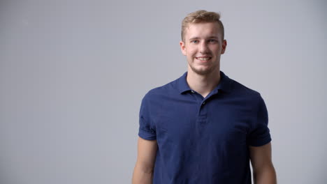 slow motion sequence of casually dressed man in studio