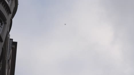 police drone in the sky surveilling the city streets