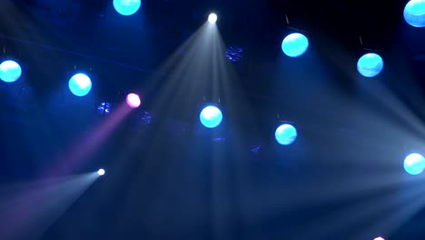 the spotlight through the smoke on stage. lighting equipment. effect lights. scanner. color changers. moving yoke. moving head