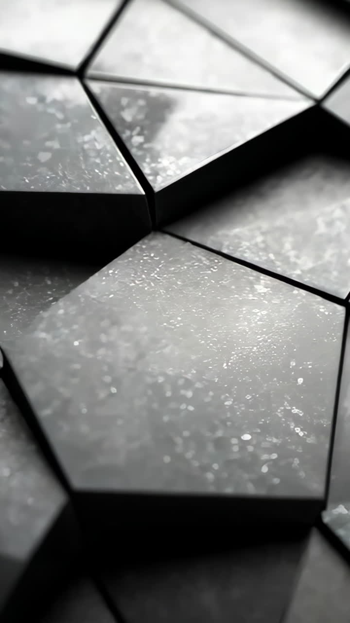 A black and white photo of a jagged, broken surface. The photo is abstract and has a sense of chaos and disorder