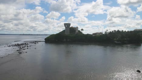 Aerial-shot-rising-up-over-the-latte-of-freedom-to-view-downtown-Tamuning