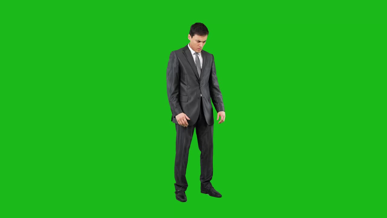 Man in Suit Standing on Green Screen