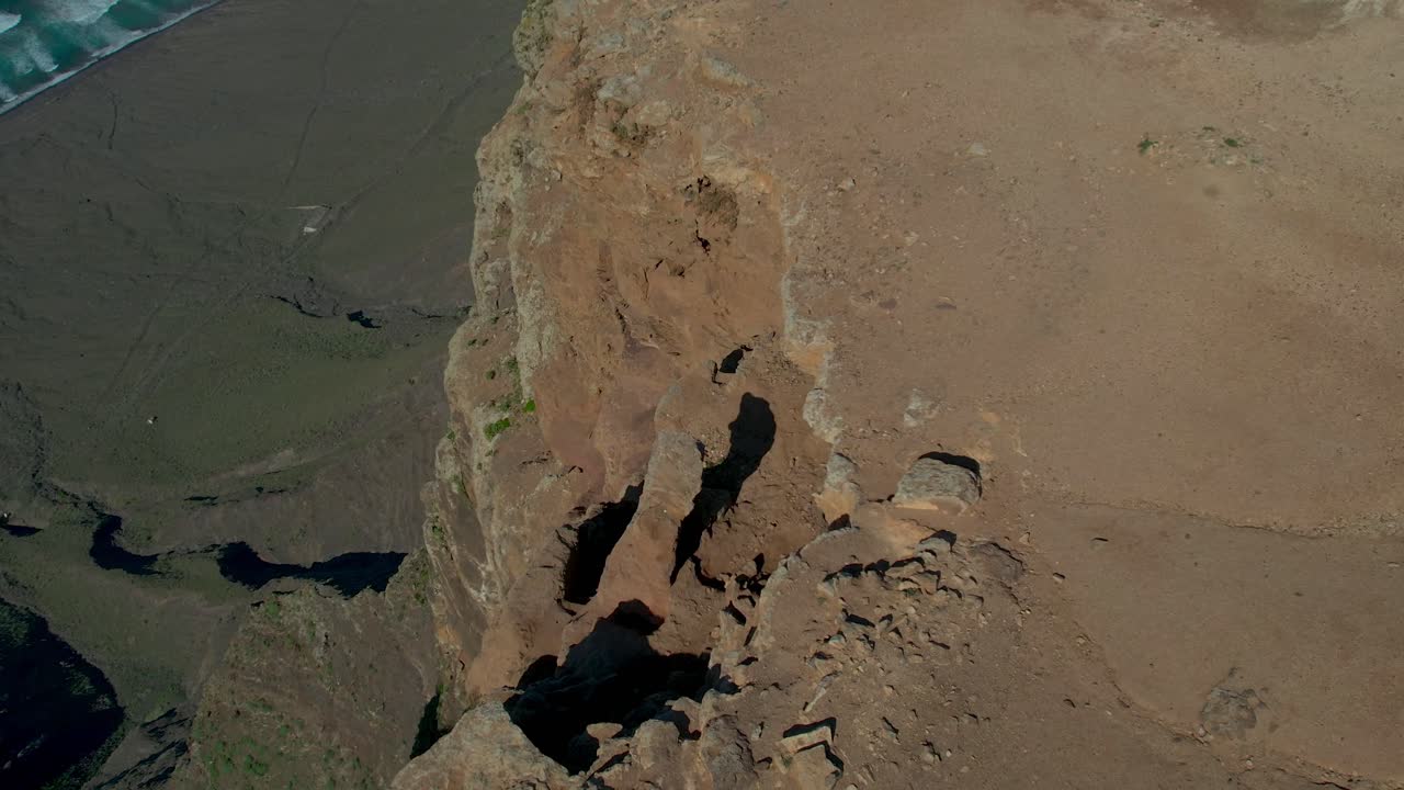Aerial drone view of mountain sea and volcanoes in Lanzarote, Canary Islands, Spain