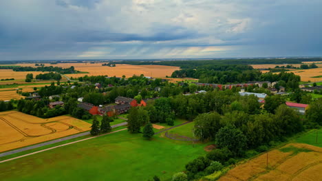 summer aerial view of a village in latvia, cloudy day