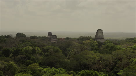 tikal ruins in guatemala. view of pyramids from temple iv. ancient maya civilization. establisher