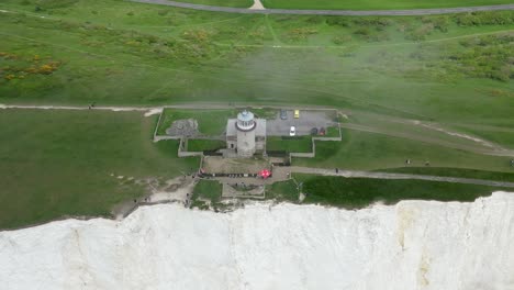 flying towards belle tout lighthouse, white cliffs, foggy sky and sea