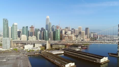 aerial view of san francisco city skyline and bay bridge at sunrise