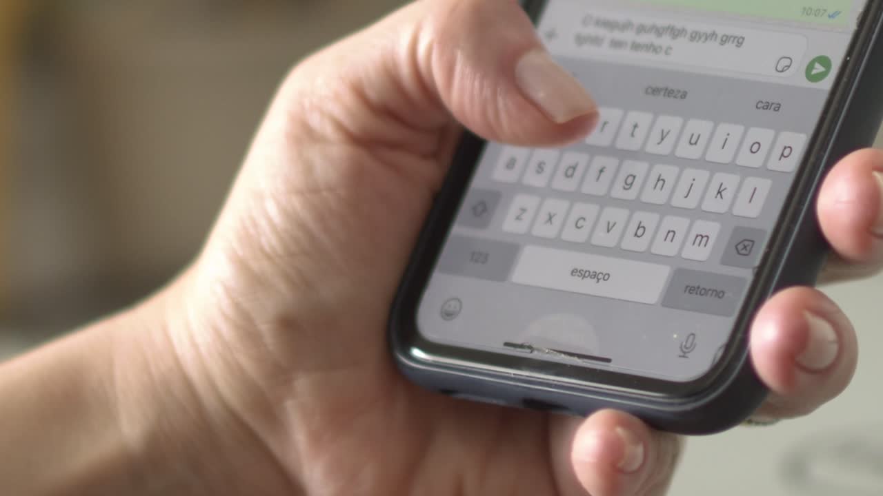 Close-up of a Person Texting on Their Smartphone