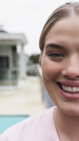vertical video of smiling caucasian female nurse, slow motion