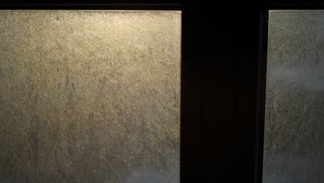 close-up of a dirty frosted glass window pane