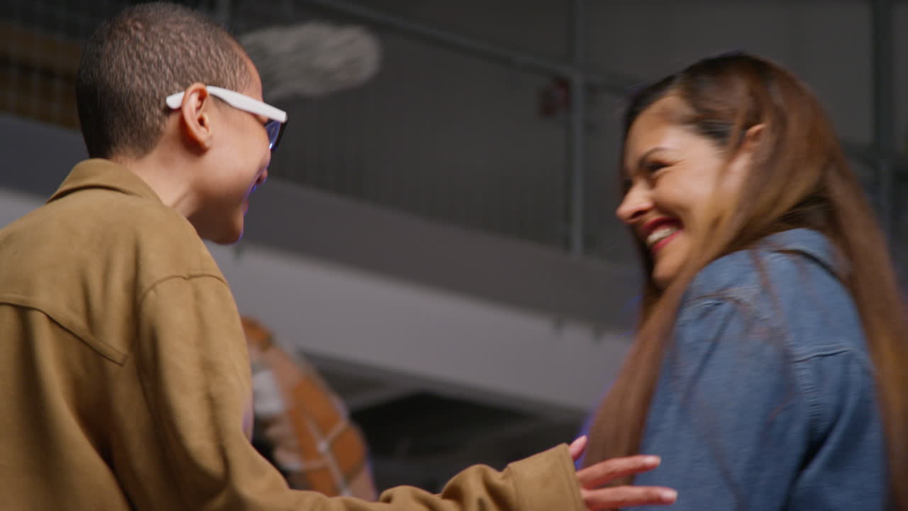 A group of friends laughing and talking together