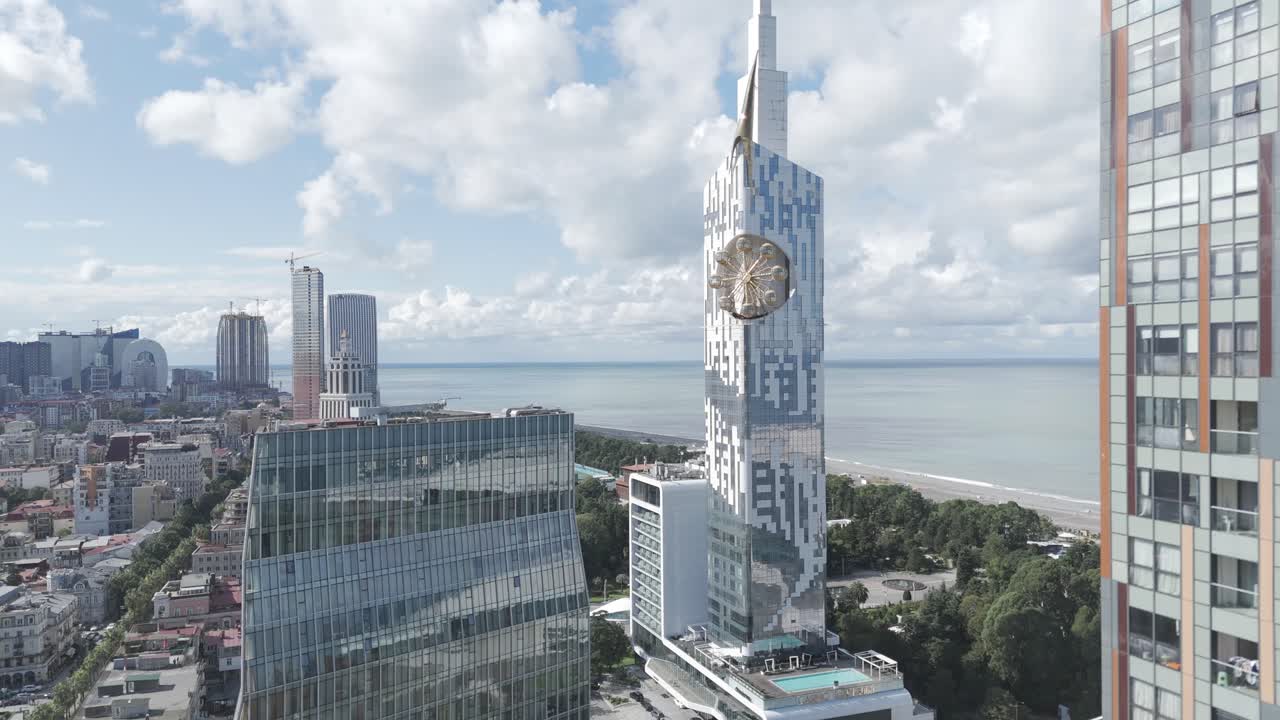 Cinematic daytime drone footage of Batumi skyline and skyscrapers.