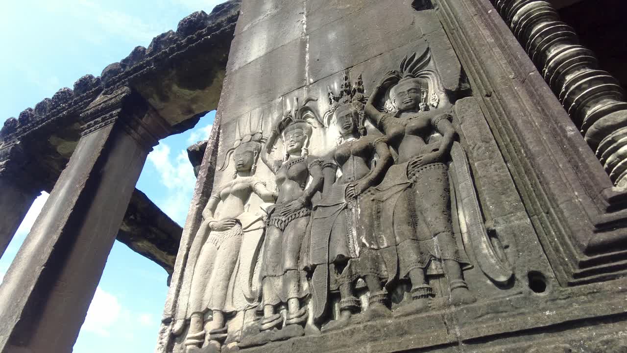 Intricate Bas-reliefs At Angkor Wat Monument In The Angkor Area Near Siem Reap, Cambodia. Low Angle Shot