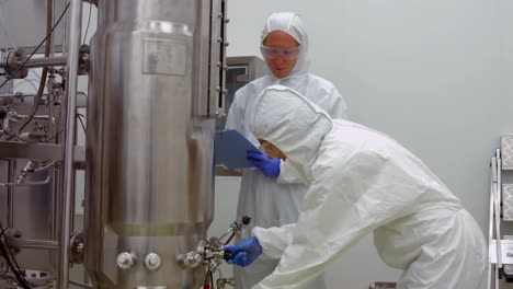 Scientists-in-protective-suits-working-together