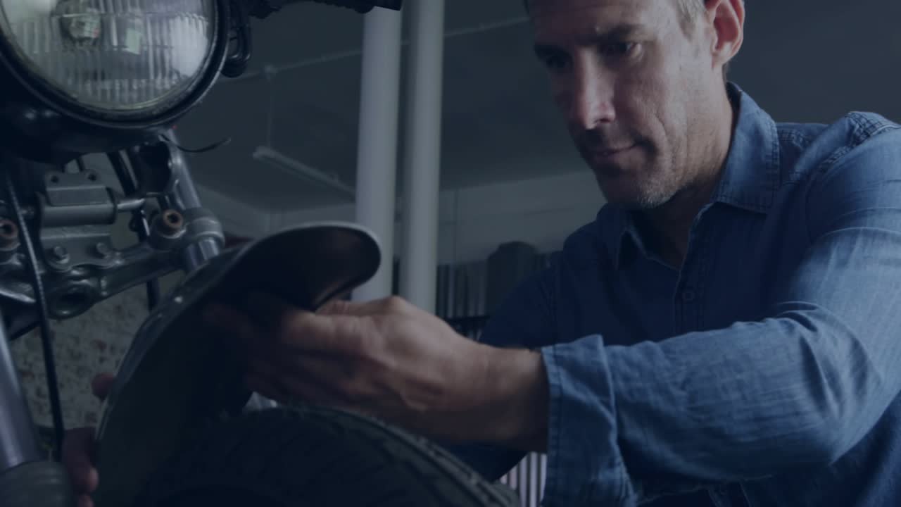 Mechanic inspecting wheel, tapping stylus at temple, activating diagnostic hologram, analyzing wear