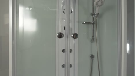 adjusting a modern shower door