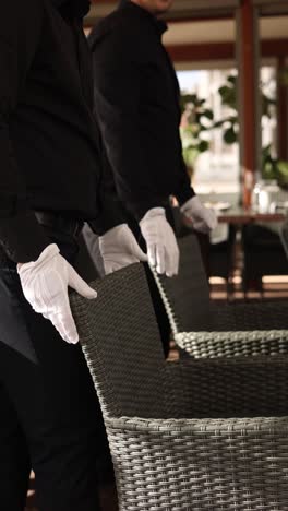 restaurant staff setting tables