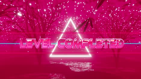 Animation-of-level-completed-text-in-metallic-pink-and-white-triangle-over-pink-trees-and-lights
