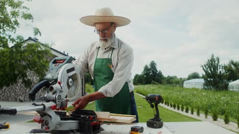 senior carpenter working outdoors