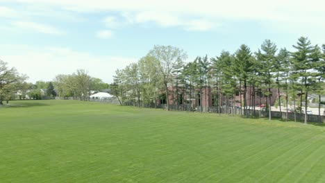 aerial horizontal pan over a soccer field with green grass