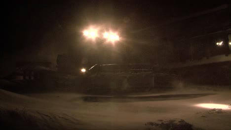 a snowplow passes during a big snowstorm or blizzard