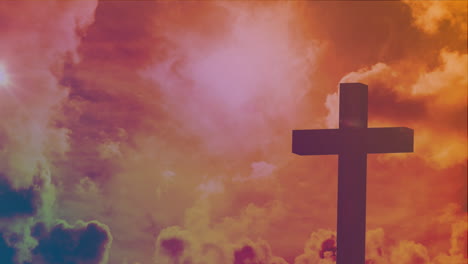 video of lights over black crucifix shape on clouds