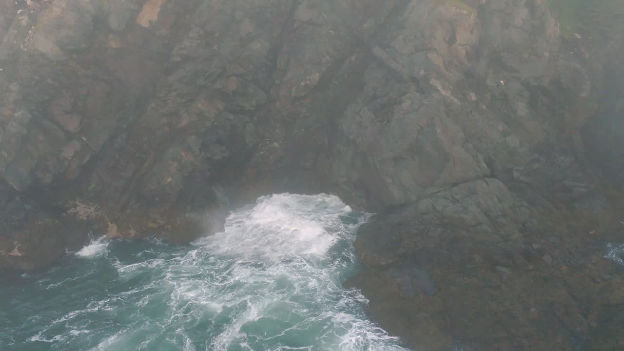 Breathtaking Slow-Motion Close-up of Waves Crashing on Foggy Maine Coastline