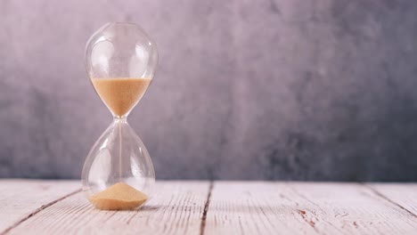 hourglass on a wooden table