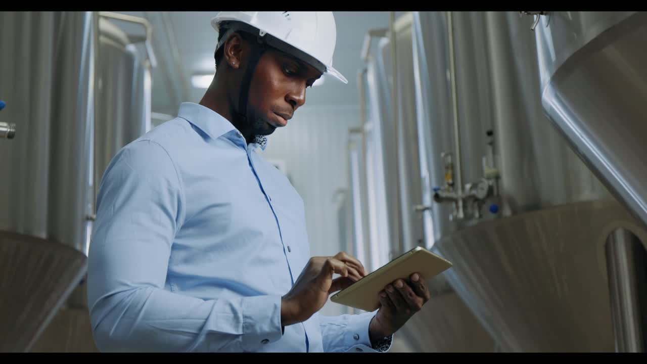 Brewery Worker Using Tablet