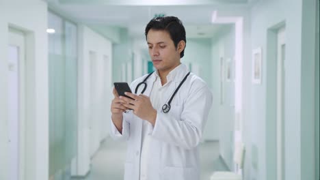 Indian-doctor-chatting-on-phone