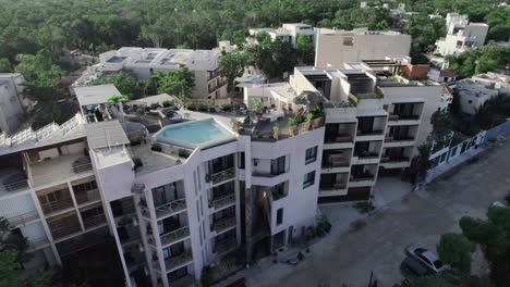 aerial-tilt-up-shot-of-hotel-complex-in-Riviera-Maya-Mexico-during-summertime