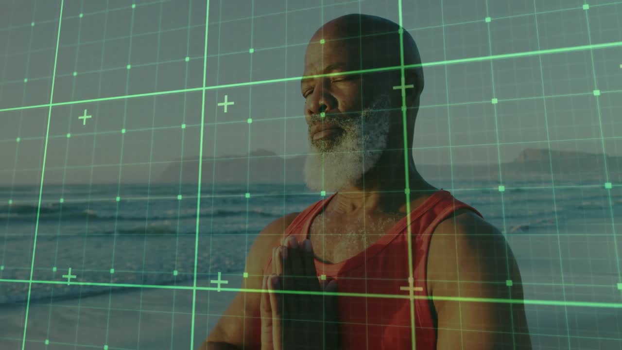 Senior male meditator lifting hands into prayer pose, guided by scanning grid on beach for wellness