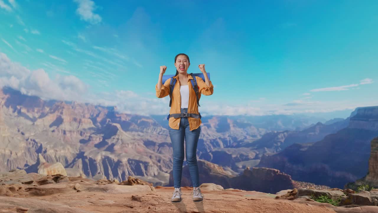 Full Body Of Asian Female Hiker With Mountaineering Backpack Screaming Goal Celebrating The Success While Traveling At The Top Of Mountain