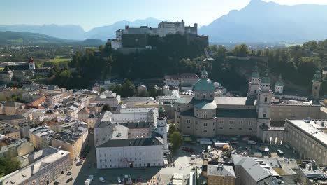 cinematic drone shot reveals salzburg castle - pan up