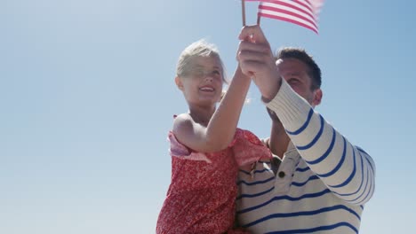 Man-and-his-daughter-enjoying-free-time-on-the-beach-together