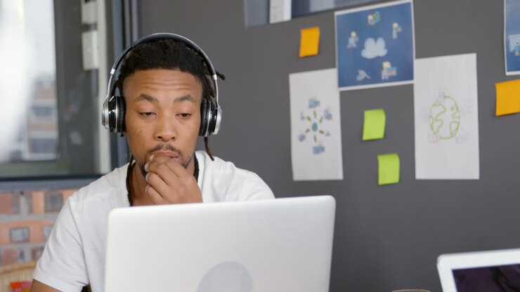Attentive male executive working on laptop in office 4k